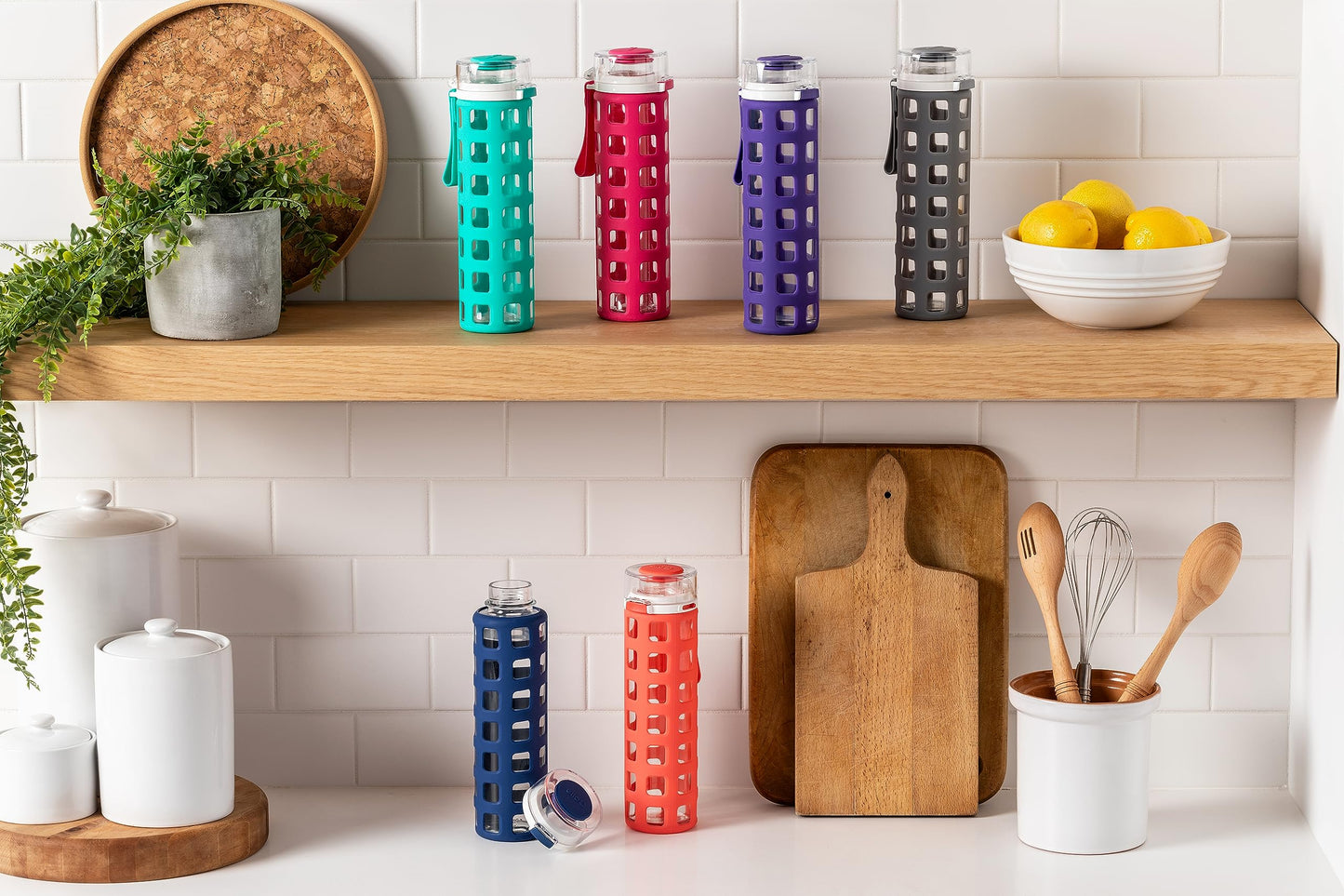 20 oz Ello Syndicate Reusable Glass Water Bottle with One-Touch Leak-Proof Flip Lid, Non-Slip Silicone Sleeve, Carry Loop, BPA-Free, Dishwasher Safe, Bold Blue